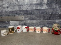 Christmas mugs and snow globe