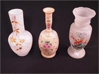 Three Victorian vases decorated with flowers and