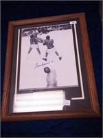 Signed photo of Muhammad Ali in ring with