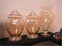 Two lidded and etched glass jars, 9 1/2" high