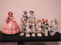 12 figurines: five are children with instruments,