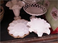 Five pieces of milk glass: egg plates; ruffled