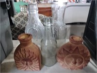 Glass milk jugs and some pottery