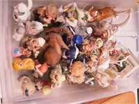 Container of figurines: people,