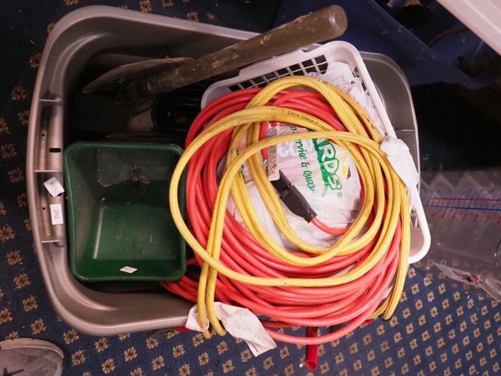 Container of electrical cords, tools, shovel,