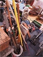 Group of garden tools: rakes, shovels,