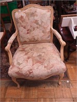 Upholstered armchair with wood trim
