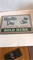 12 in x 17 in metal Mountain Dew sign