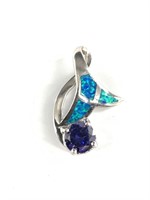 Sterling silver pendant with blue stone set throug