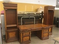 Large executive desk with 2 book shelves.