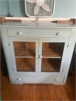 Baby blue painted cabinet with drawers
