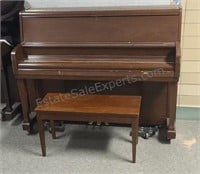 Kawai upright piano.  Includes bench and piano