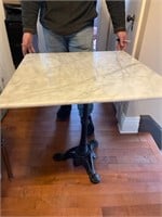 Cast iron base marble top table