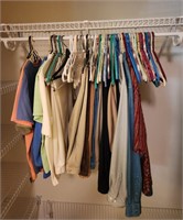 Closet with Mixed Lot of Clothes and Hangers