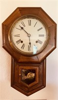 Antique regulator wall clock running