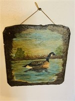 Hand-painted Canadian goose on a square roof
