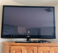 LG 42 inch flatscreen TV, on a stand, with the
