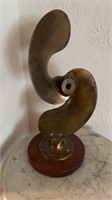 Antique brass boat propeller sculpture, mounted