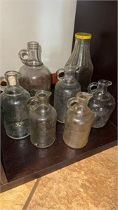 7 White House vinegar bottles, one tall