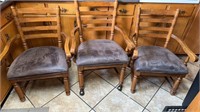 Three matching armchairs, with a suede leather