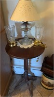 Round top side table, with an oil lamp, and two