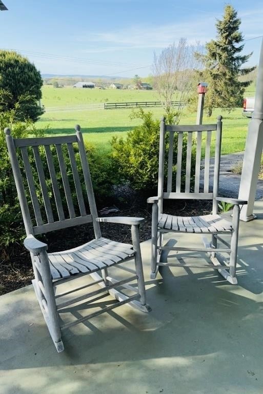 2 oversized wood porch rocking chairs, on the