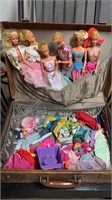 Vintage suitcase with six vintage Barbie dolls,