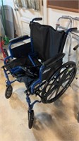 Blue, folding wheelchair, by drive, with the foot