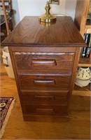 2 drawer oak file cabinet with a brass swing arm
