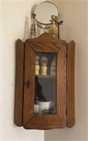 Antique oak corner cabinet with a glass front