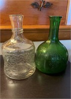 Two White House vinegar jugs, one forest green