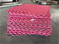 Stack of pink floor mats
