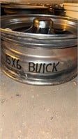 One Buick rim 15 x 6 and one miscellaneous rim
