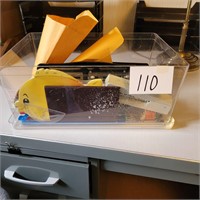 Clear Plastic Container full of Office Supplies