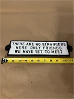 THERE ARE NO STRANGERS CAST IRON SIGN