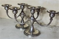 Pair of weighted sterling 302 candle holders
