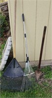 Pair of rakes and a Sledge hammer type tool