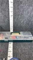sewing items in plastic organizer