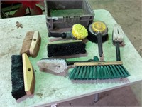 Assorted brushes and brooms