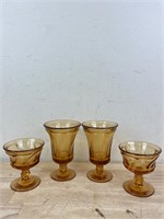 Four vintage amber wine glasses