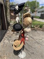 Vintage aluminum hat display with hats