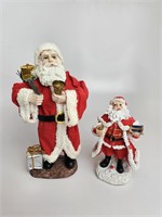 2 santa clause figurines
