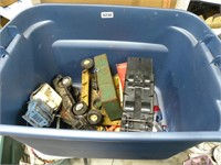 Tote of toy trucks tractor parts mostly