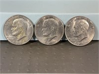 Three 1972D Ike dollars