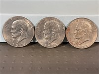 Three 1974D Ike dollars