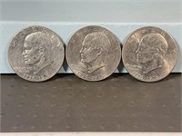 Three 1976 Ike dollars