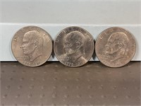 Three 1976D Ike dollars