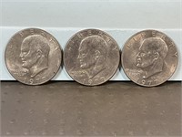 Three 1977D Ike dollars