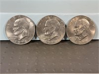 Three 1978 Ike dollars
