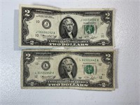 Two 1976 $2 Federal Reserve notes, taped